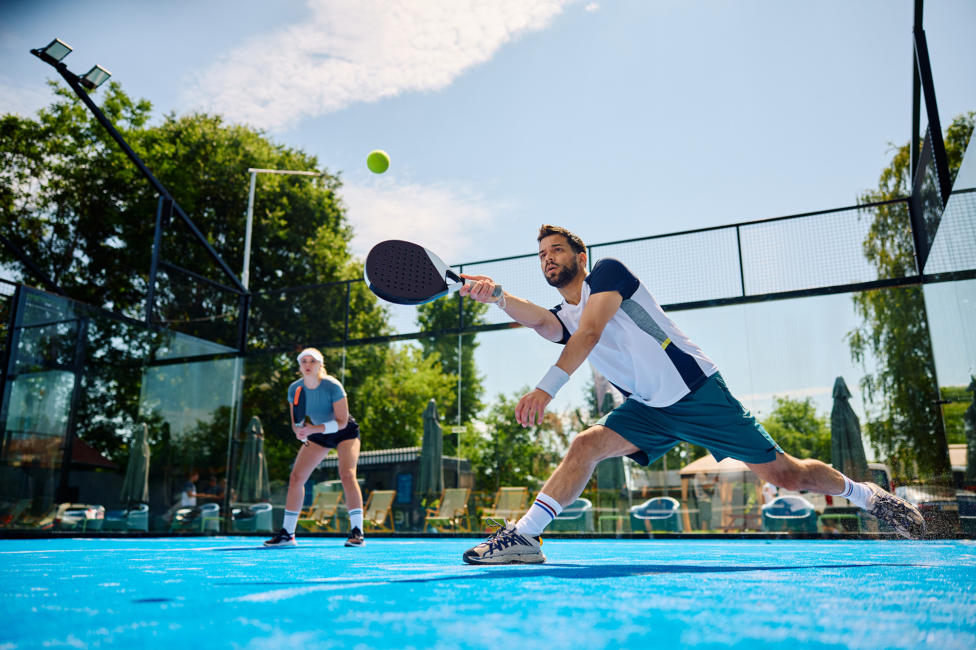 Padel coaches leading a training session at an outdoor club